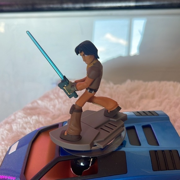 Action Figure with Blue Lightsaber on Vehicle - Picture 3 of 5